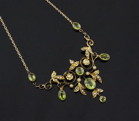 An Edwardian gold, peridot and seed pearl set pendant, 16.5in.